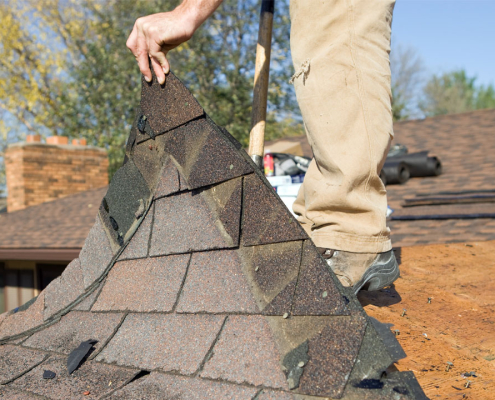 Photo showing someone replacing an old roof
