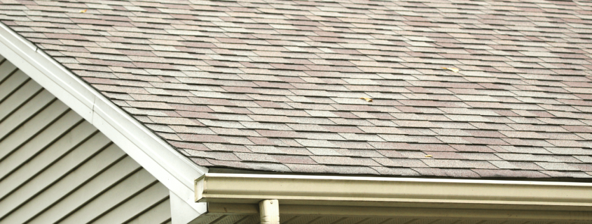 An artistic representation of a house with architectural shingles, showcasing their aesthetic appeal.