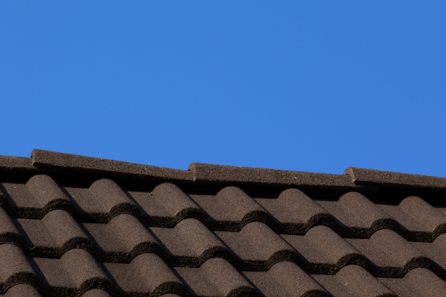 Different types of ridge cap shingles laid out for comparison. 