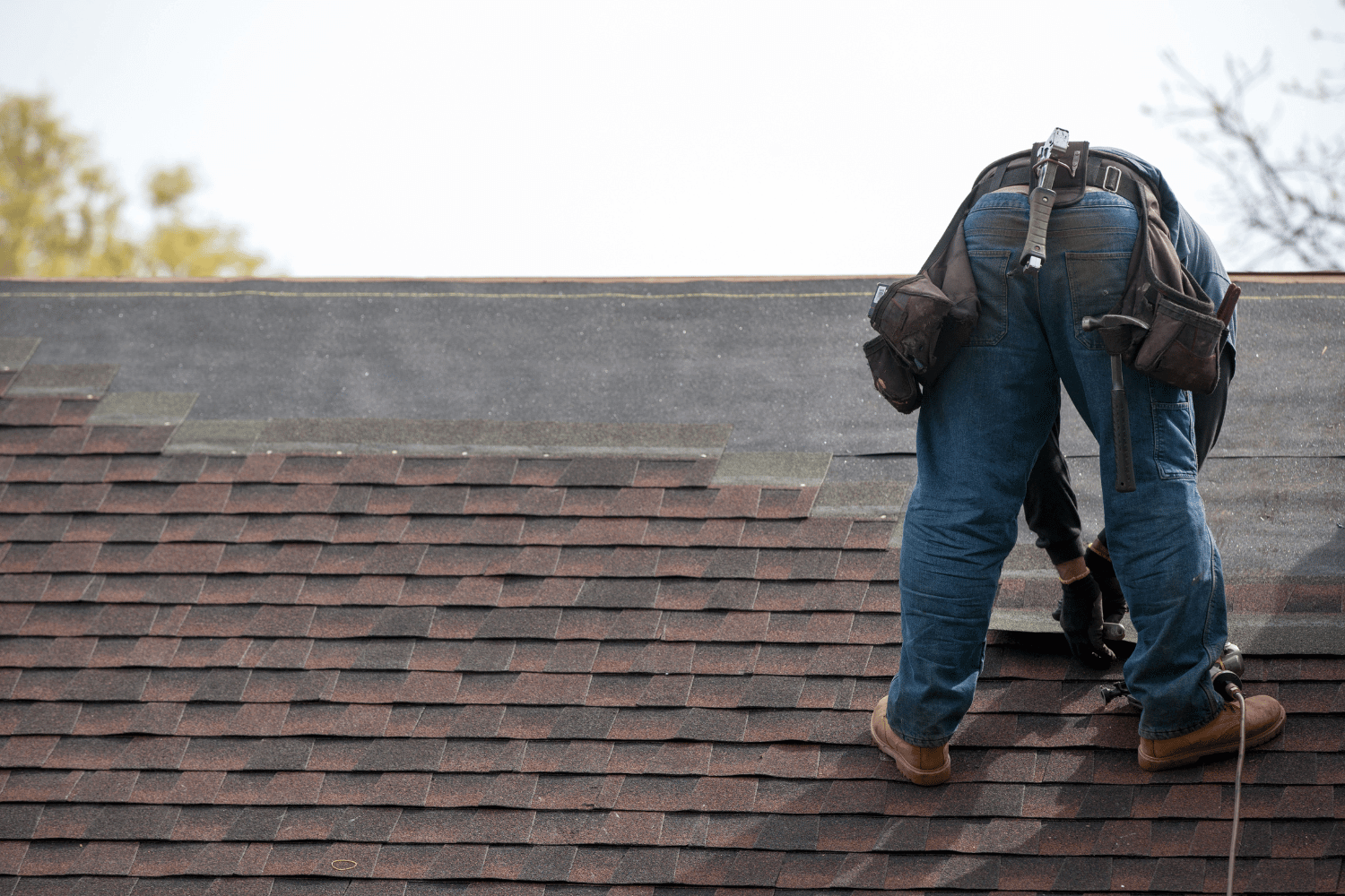 A professional roofing crew demonstrating installation techniques for different roofing materials. 