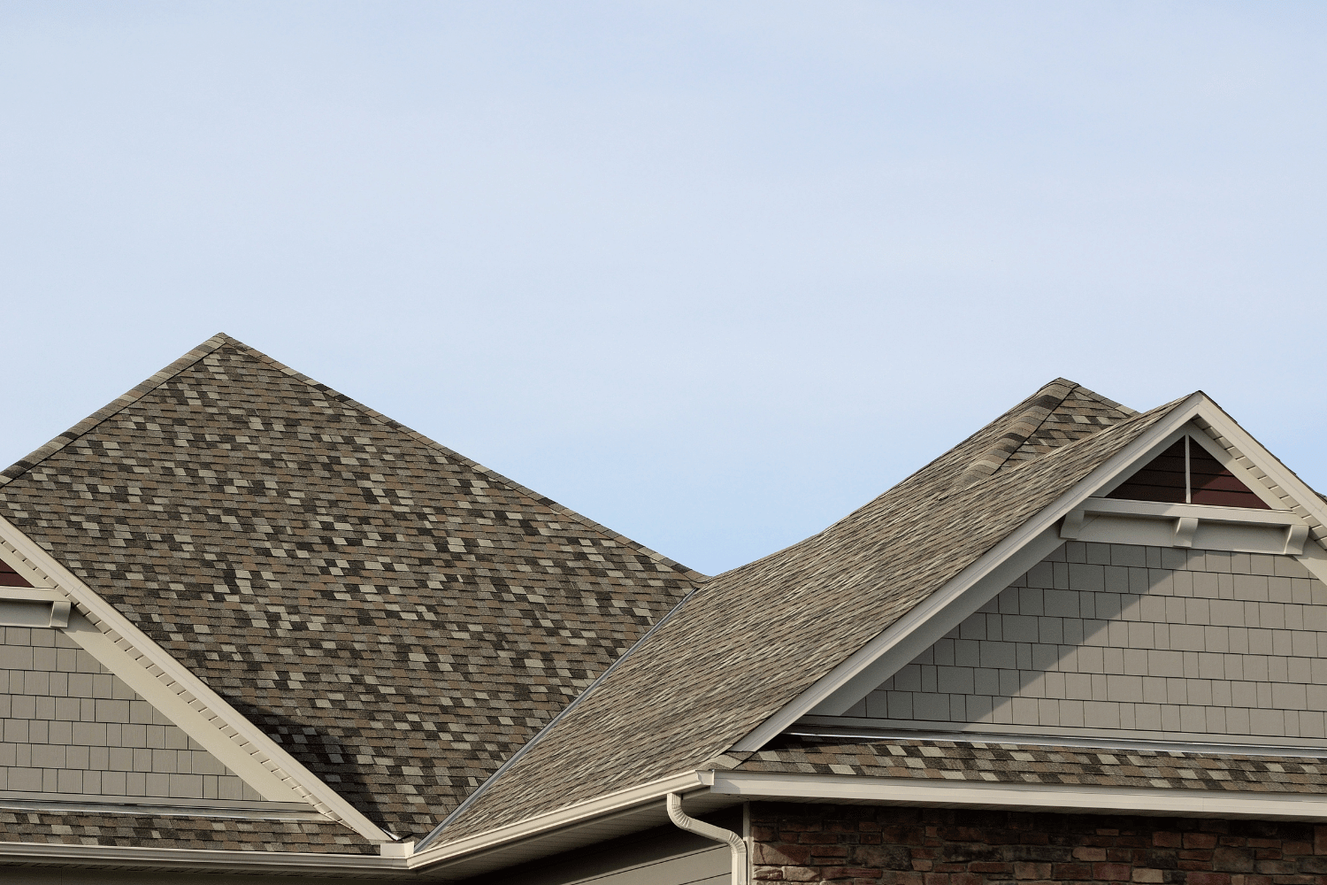 An artistic representation of popular asphalt shingle brands. 