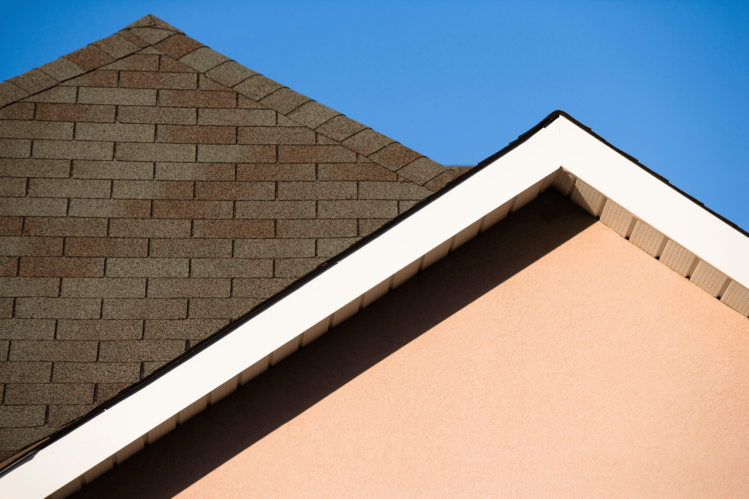 An illustration showing different roof pitches, including a low pitch roof with asphalt shingles. 