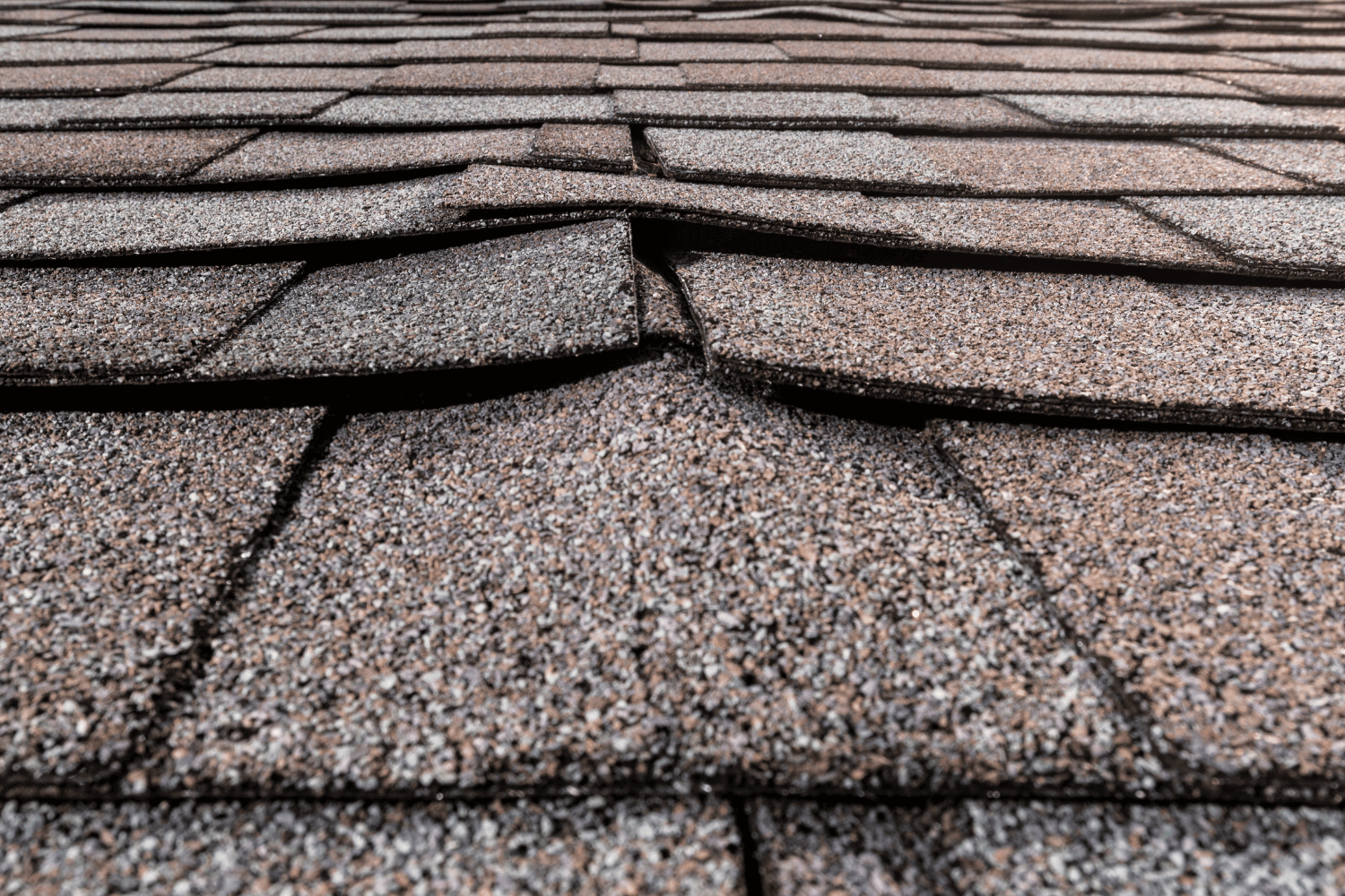 Common causes of shingle buckling illustrated on a roof. 