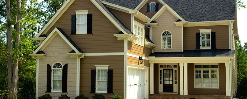 Home-Services-two-story-beige-house-white-trim