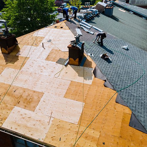 A roof covered with wooden shingles, showcasing a natural and rustic architectural style