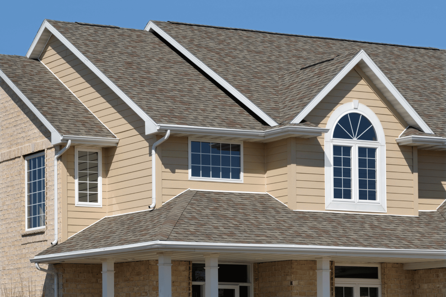 A beautifully designed house showcasing enhanced curb appeal with new roofing. 