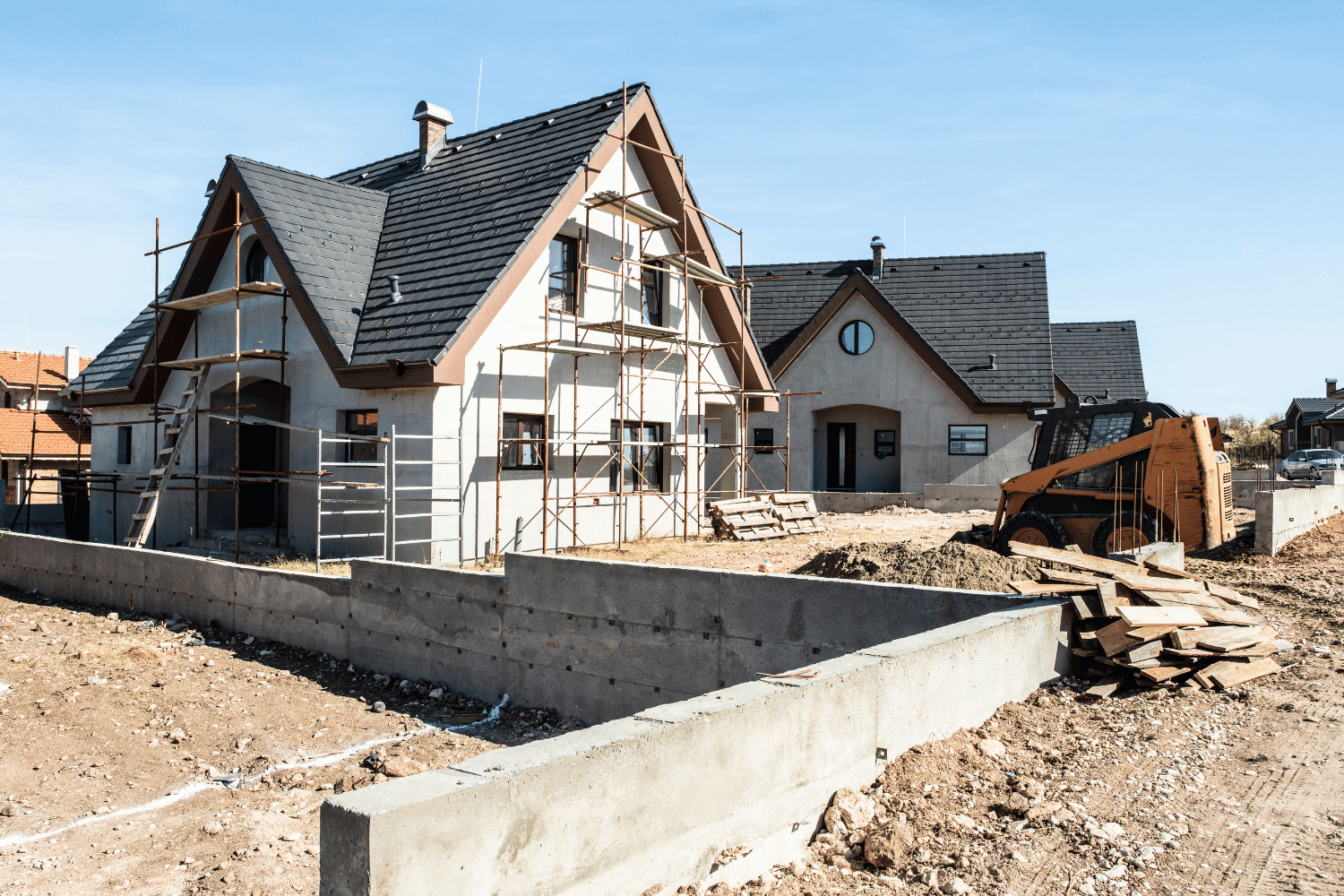 A construction site showcasing new construction roofing materials. 