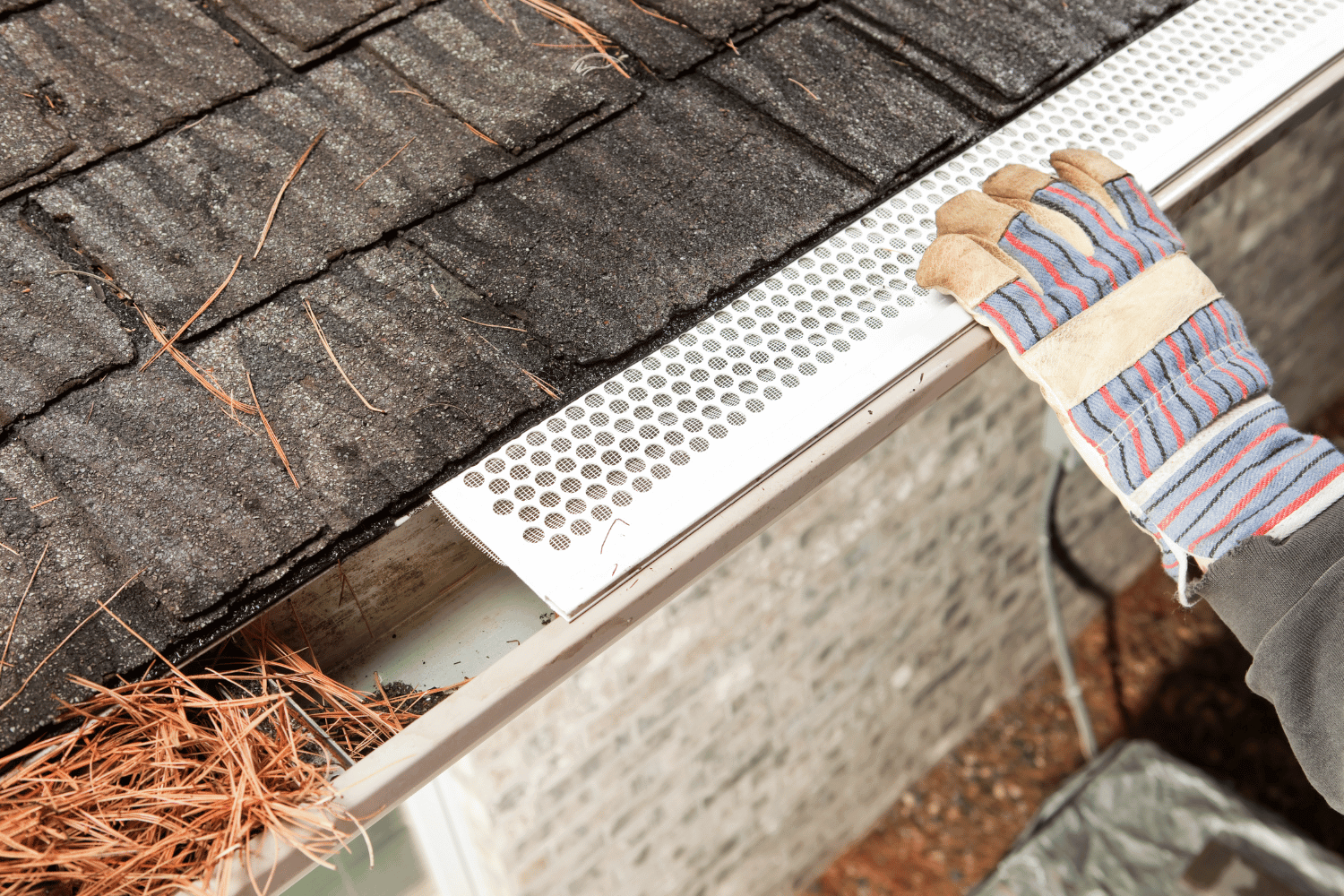 A home with gutter guards installed, showcasing their importance in protecting the gutter system. 