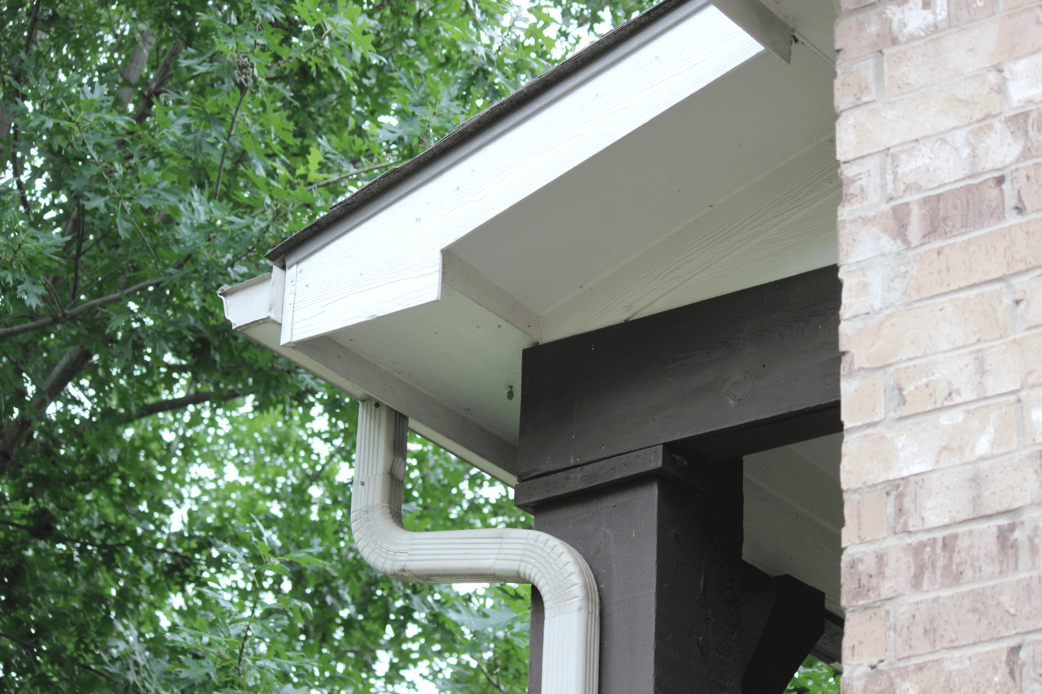 Old gutters being replaced with new ones during a roof replacement. 