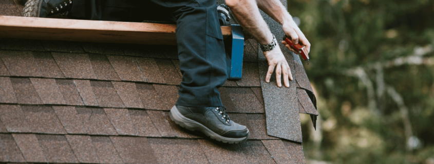 A roofing contractor installing 30-year shingles on a home.