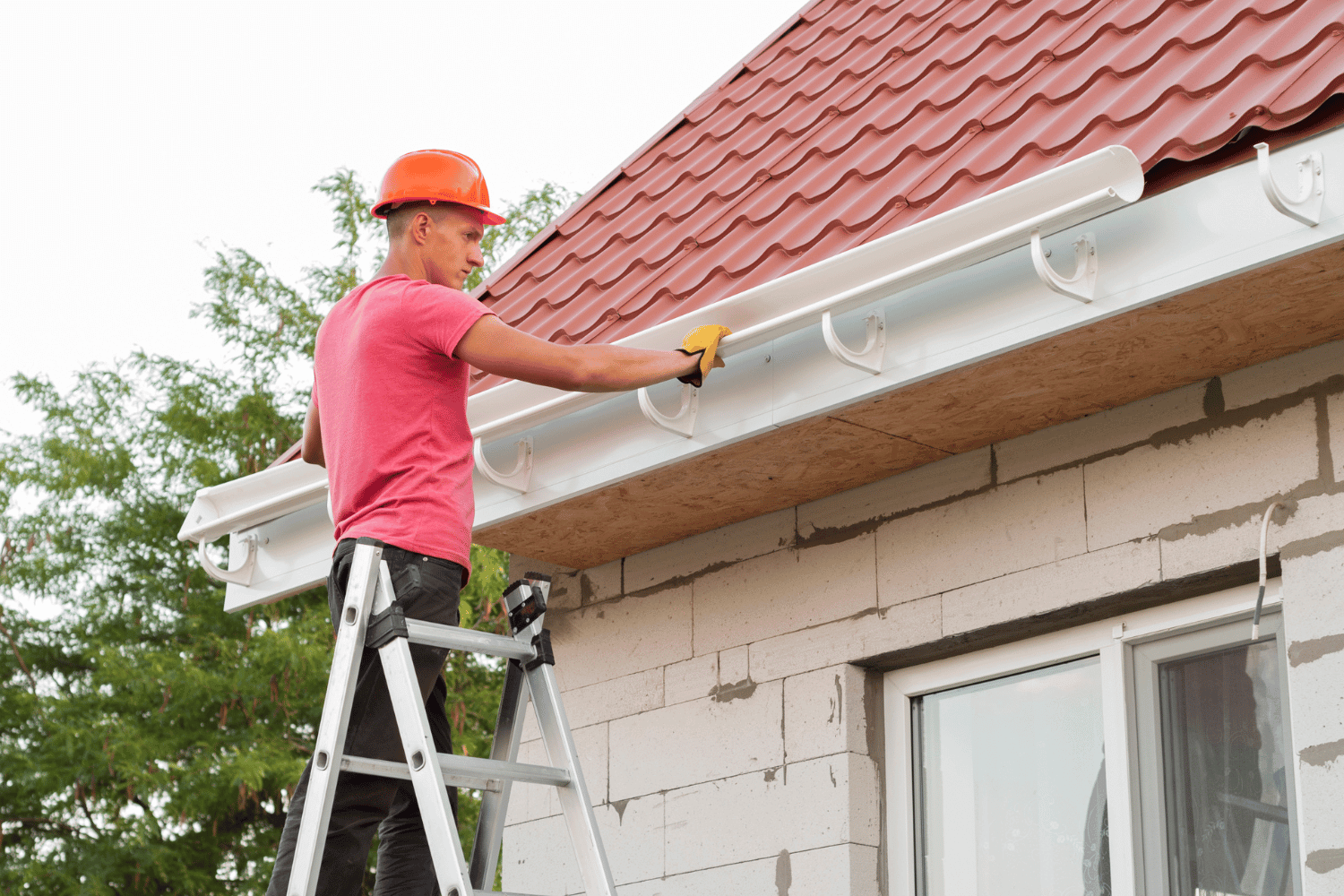 Planning a gutter installation project with tools and materials.