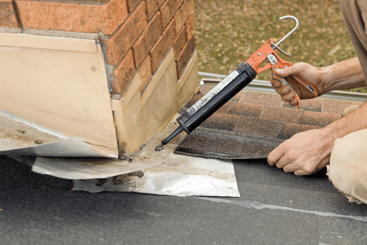 Various materials needed for sealing chimney flashing.