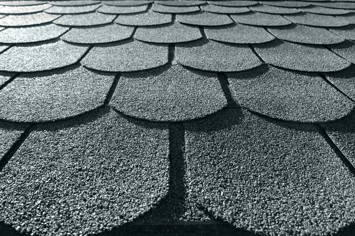 Various types of asphalt shingles displayed together.