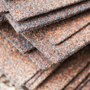 Key roofing materials including asphalt shingles and underlayment.